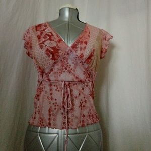 Tan and pink shirt that hugs your curves